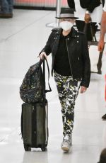 CYNDI LAUPER and David Thornton at JFK Airport in New York 06/10/2022