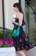 DAKOTA JOHNSON at a Photoshoot at Sunset Plaza in West Hollywood 06/17/2022