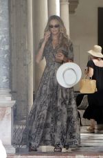ELLE MACPHERSON Leaves Her Hotel in Seville 06/16/2022