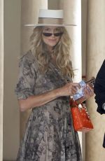 ELLE MACPHERSON Leaves Her Hotel in Seville 06/16/2022