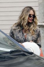ELLE MACPHERSON Leaves Her Hotel in Seville 06/16/2022