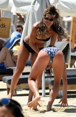 KATYA JONES and AMIE FULLER in Bikinis at a Beach in Mykonos 06/08/2022