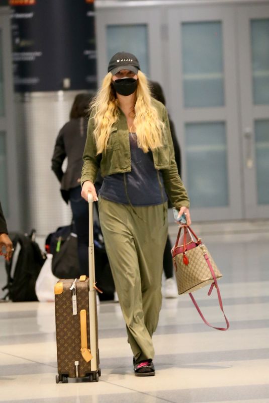 KESHA SEBERT Arrives at JFK Airport in New York 06/20/2022