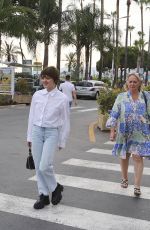 MAISIE WILLIAMS Out Trying to Hide Her Cigarette in Cannes 06/21/2022