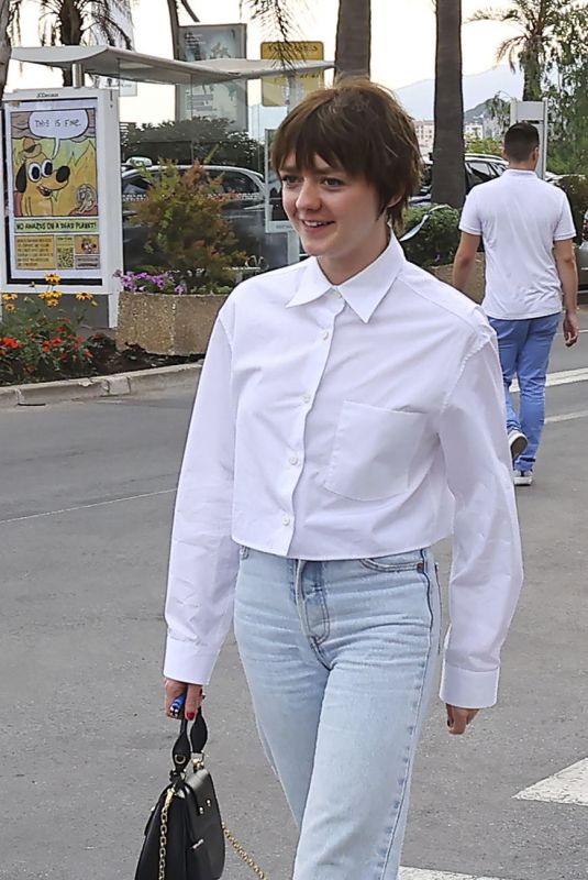 MAISIE WILLIAMS Out Trying to Hide Her Cigarette in Cannes 06/21/2022