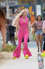 MARGOT ROBBIE Wearing Roller Skates on the Set of Barbie at Venice Beach 06/27/2022