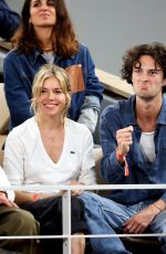 SIENNA MILLER and Oli Green at French Open 2022 at Roland Garros in Paris 06/03/2022