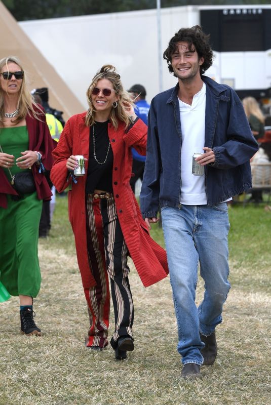 SIENNA MILLER Out at Glastonbury Festival 06/24/2022