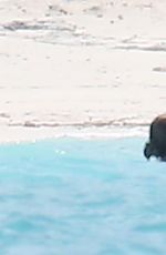 TAYLOR SWIFT in Bikini and Joe Alwyn at a Beach in Bahamas 06/19/2022