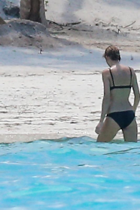 TAYLOR SWIFT in Bikini and Joe Alwyn at a Beach in Bahamas 06/19/2022