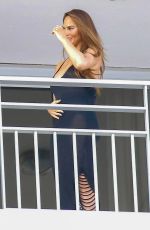 CHRISSY TEIGEN and John Legend on the Balcony of Their Hotel in Nice 07/11/2022