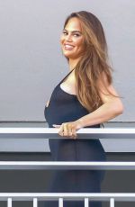 CHRISSY TEIGEN and John Legend on the Balcony of Their Hotel in Nice 07/11/2022