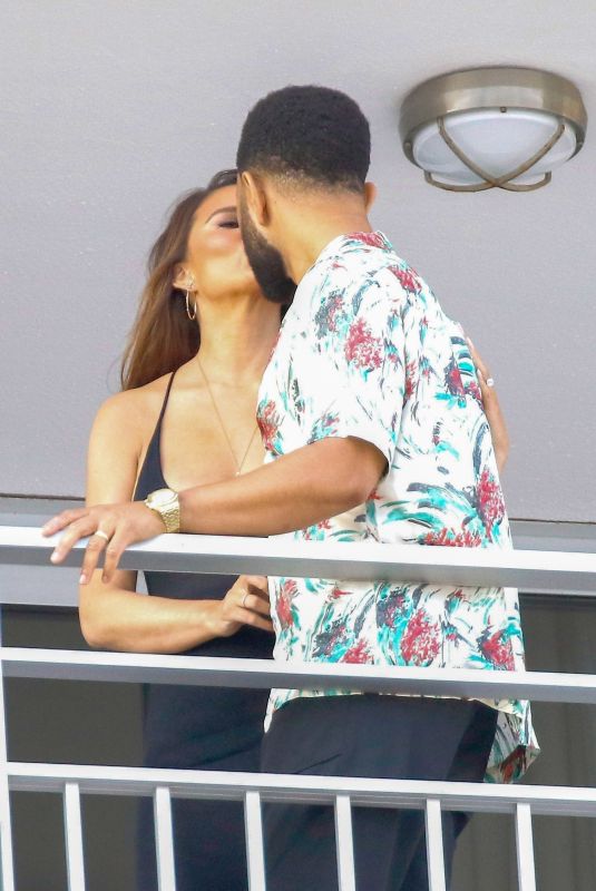 CHRISSY TEIGEN and John Legend on the Balcony of Their Hotel in Nice 07/11/2022