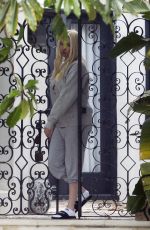 ERIKA JAYNE Gets a Starbucks Coffee Bag Delivered at Her Home in Los Angeles 07/14/2022