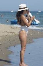 EVA LONGORIA in a White Swimsuit at a Beach in Marbella 07/18/2022