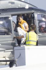 GIGI HADID Leaves a Helicopter on the Roof of a Yacht in Saint-Tropez 07/21/2022