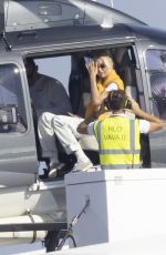 GIGI HADID Leaves a Helicopter on the Roof of a Yacht in Saint-Tropez 07/21/2022