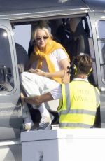 GIGI HADID Leaves a Helicopter on the Roof of a Yacht in Saint-Tropez 07/21/2022