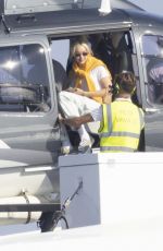 GIGI HADID Leaves a Helicopter on the Roof of a Yacht in Saint-Tropez 07/21/2022