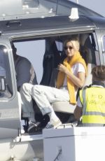 GIGI HADID Leaves a Helicopter on the Roof of a Yacht in Saint-Tropez 07/21/2022