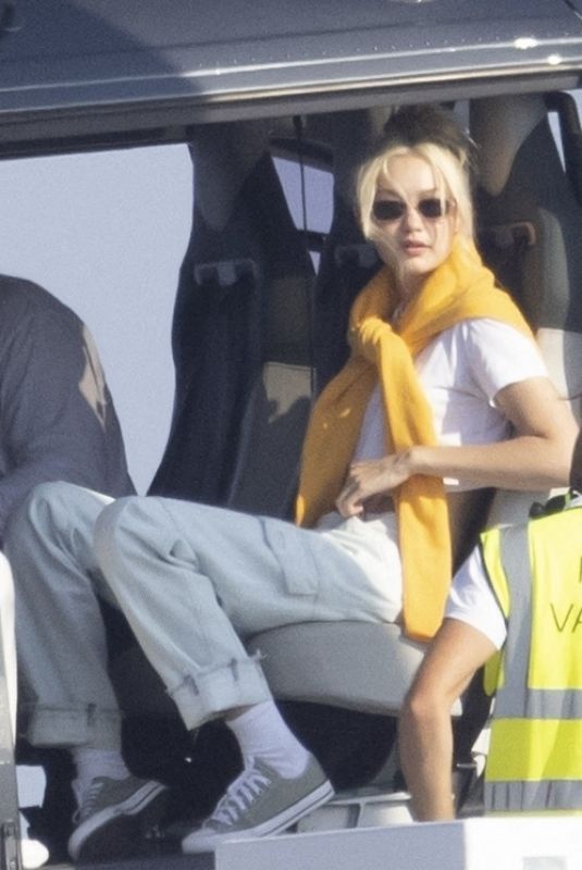 GIGI HADID Leaves a Helicopter on the Roof of a Yacht in Saint-Tropez 07/21/2022