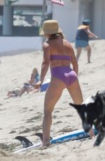 HILARY DUFF in Bikini Paddleboarding in Malibu 07/04/2022