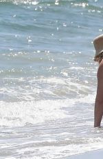 HILARY DUFF in Bikini Paddleboarding in Malibu 07/04/2022
