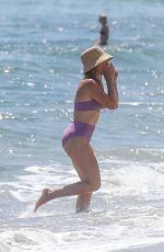 HILARY DUFF in Bikini Paddleboarding in Malibu 07/04/2022