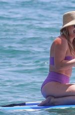 HILARY DUFF in Bikini Paddleboarding in Malibu 07/04/2022