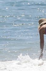HILARY DUFF in Bikini Paddleboarding in Malibu 07/04/2022