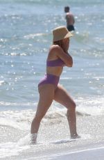 HILARY DUFF in Bikini Paddleboarding in Malibu 07/04/2022