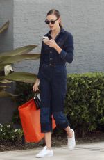 KARLIE KLOSS in Denim Jumpsuit Out in Miami 07/08/2022