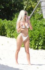 KIM and KHLOE KARDASHIAN in Metallic Bikinis at a Beach in Turks and Caicos 07/09/2022