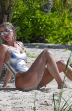 KIM and KHLOE KARDASHIAN in Metallic Bikinis at a Beach in Turks and Caicos 07/09/2022