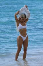 KIM KARDASHIAN in a White Bikini at a Photoshoot at a Beach in Turks and Caicos 07/01/2022