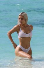 KIM KARDASHIAN in a White Bikini at a Photoshoot at a Beach in Turks and Caicos 07/01/2022