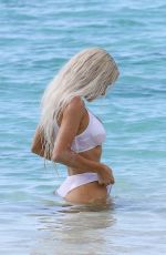 KIM KARDASHIAN in a White Bikini at a Photoshoot at a Beach in Turks and Caicos 07/01/2022