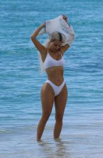 KIM KARDASHIAN in a White Bikini at a Photoshoot at a Beach in Turks and Caicos 07/01/2022