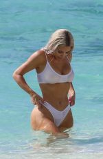 KIM KARDASHIAN in a White Bikini at a Photoshoot at a Beach in Turks and Caicos 07/01/2022