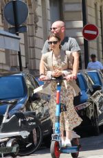 LILY COLLINS and Charlie McDowell at an Electric Scooter Out in Paris 07/02/2022