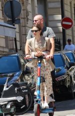 LILY COLLINS and Charlie McDowell at an Electric Scooter Out in Paris 07/02/2022