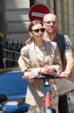 LILY COLLINS and Charlie McDowell at an Electric Scooter Out in Paris 07/02/2022