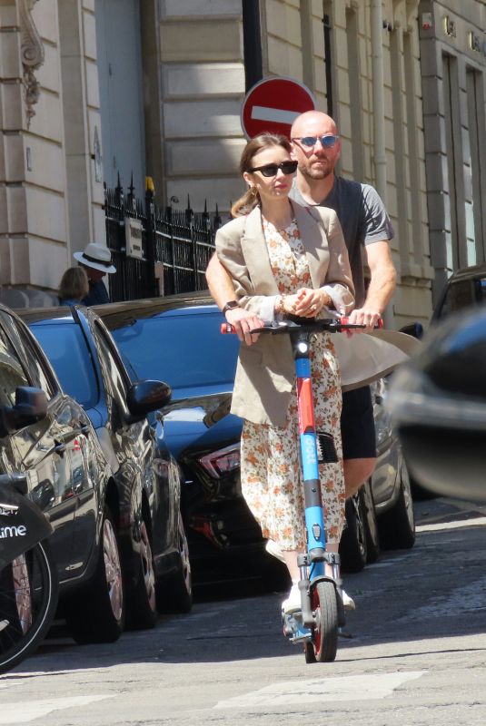 LILY COLLINS and Charlie McDowell at an Electric Scooter Out in Paris 07/02/2022