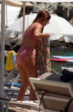 MILLIE MACKINTOSH in Bikini and Hugo Taylor at a Beach on Corfu Island 07/23/2022