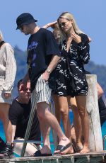 NATASHA POLY and Peter Bakker Arrives at Club 55 Beach in Saint-Tropez 07/17/2022