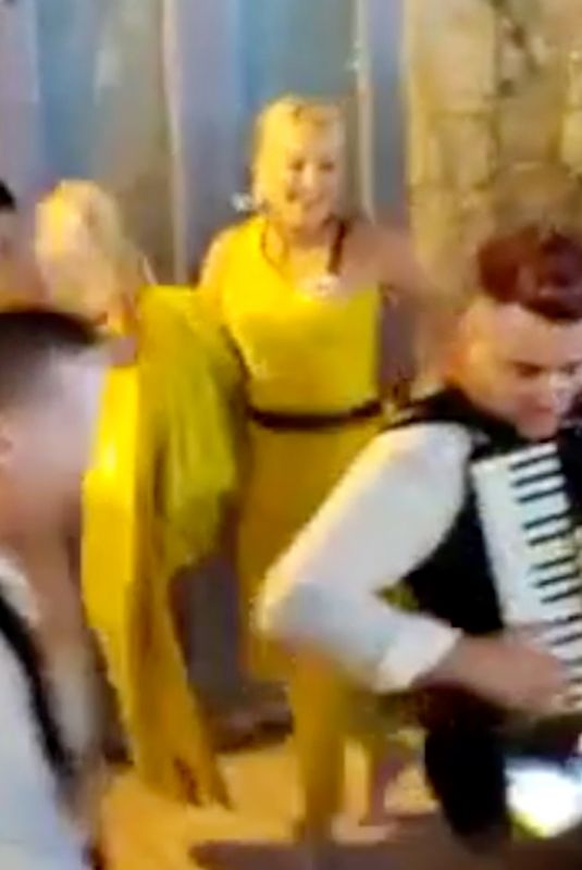 SHARON STONE Dancing Tarantella with a Local Band in Messina 07/11/2022