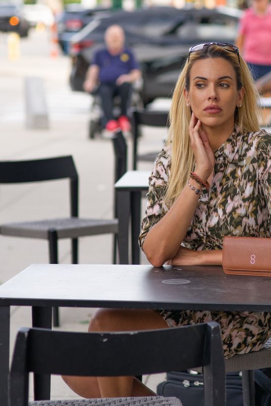 TANIA MARIE CARINGI at a Starbucks in New York 06/30/2022