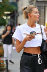 ALINA BAIKOVA Out Smoking Her Vape in New York 08/18/2022