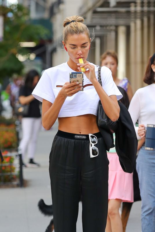 ALINA BAIKOVA Out Smoking Her Vape in New York 08/18/2022