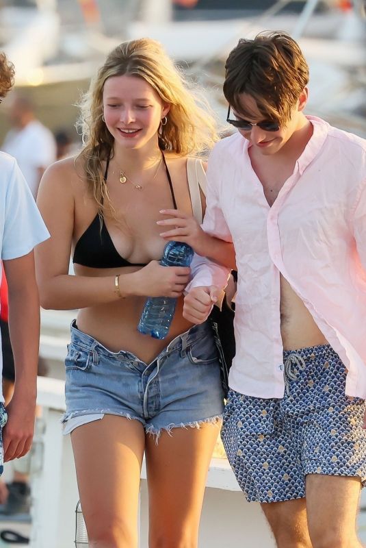 APPLE MARTIN Out with a Male Friend in Ibiza 07/23/2022